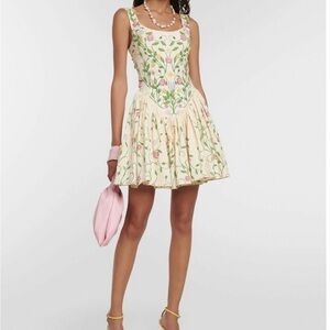 AguaAgua Bendita Pluma Estelar dress is carefully hand embroidered with florals